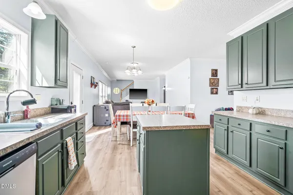 a kitchen with lots of counter top space sink stove and cabinets