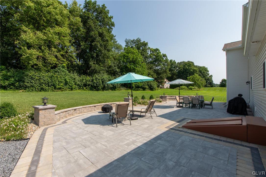 2152 Terry Road Nazareth, PA 18064 - Photo 13 of 42 a view of a patio with a table and chairs under an umbrella