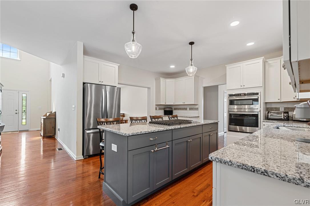2152 Terry Road Nazareth, PA 18064 - Photo 17 of 42 a kitchen with stainless steel appliances granite countertop a sink refrigerator and cabinets