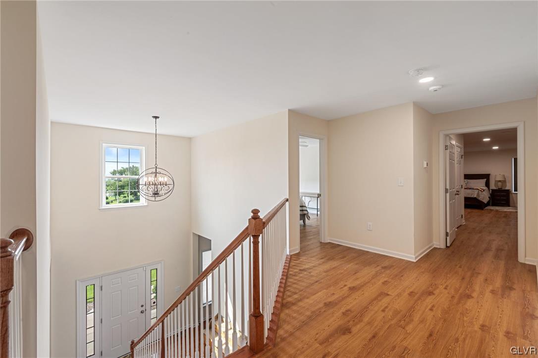 2152 Terry Road Nazareth, PA 18064 - Photo 29 of 42 a view of a hallway with wooden floor and staircase