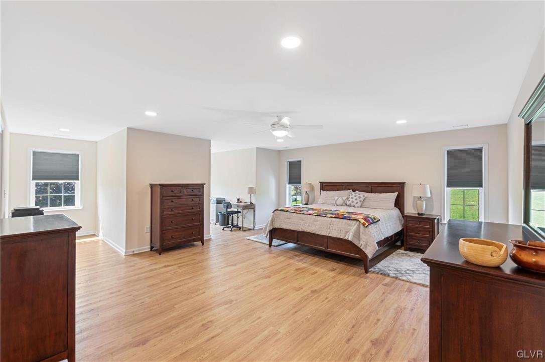 2152 Terry Road Nazareth, PA 18064 - Photo 33 of 42 a spacious bedroom with a bed and wooden floor