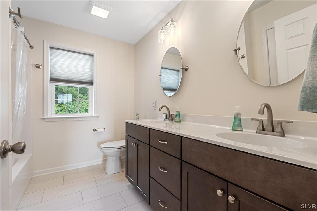 2152 Terry Road Nazareth, PA 18064 - Photo 37 of 42 a bathroom with a double vanity sink and a mirror