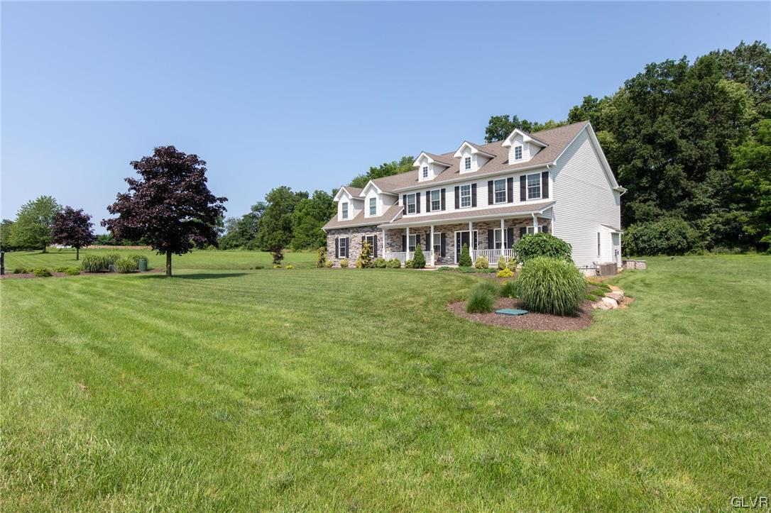 2152 Terry Road Nazareth, PA 18064 - Photo 9 of 42 a front view of a house with a garden