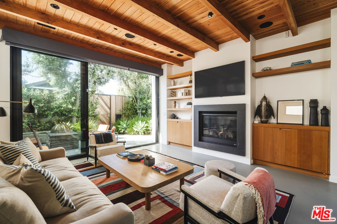 44 Horizon Avenue Venice, CA 90291 - Photo 1 of 33 a living room with furniture a fireplace and a flat screen tv