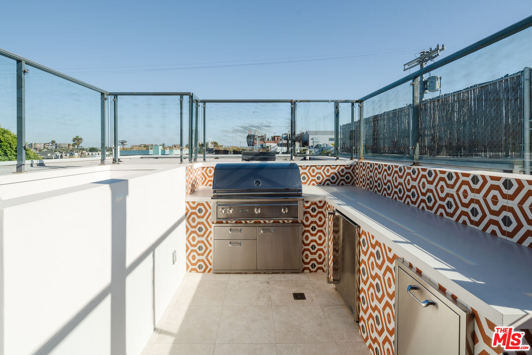 44 Horizon Avenue Venice, CA 90291 - Photo 28 of 33 a kitchen with stainless steel appliances granite countertop a stove a sink and a refrigerator