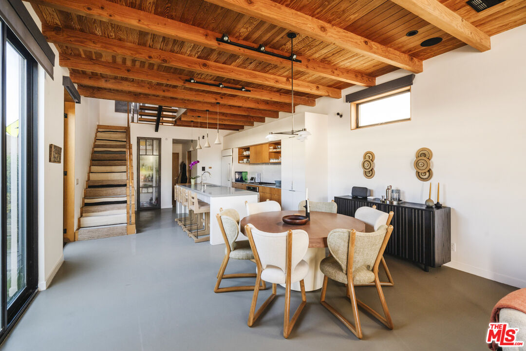 44 Horizon Avenue Venice, CA 90291 - Photo 9 of 33 a dining room with furniture and a floor to ceiling window