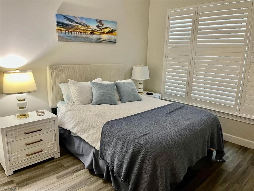 6907 Cay Court Naples, FL 34113 - Photo 12 of 15 a bedroom with a bed and a window