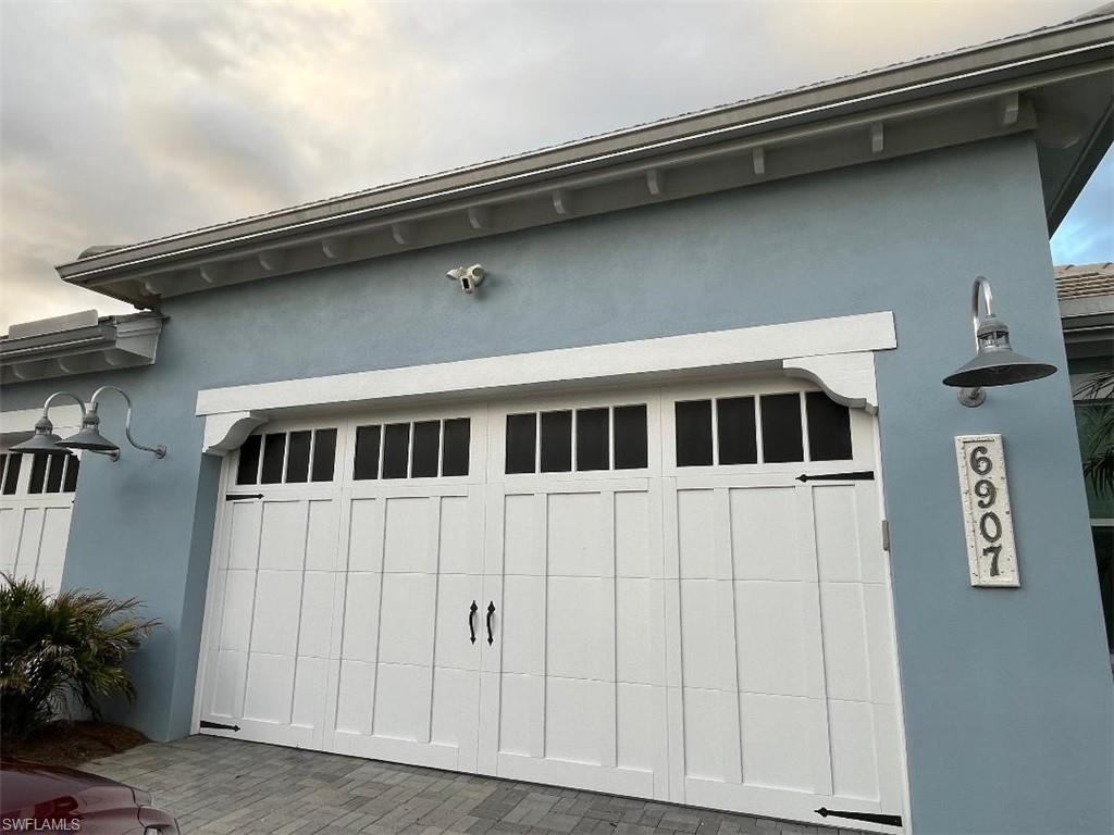 6907 Cay Court Naples, FL 34113 - Photo 15 of 15 a front view of a house