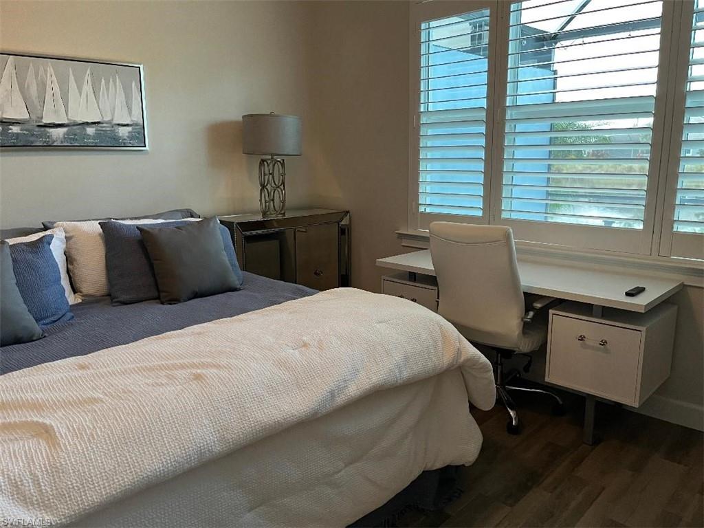 6907 Cay Court Naples, FL 34113 - Photo 10 of 15 a bedroom with a bed and a desk