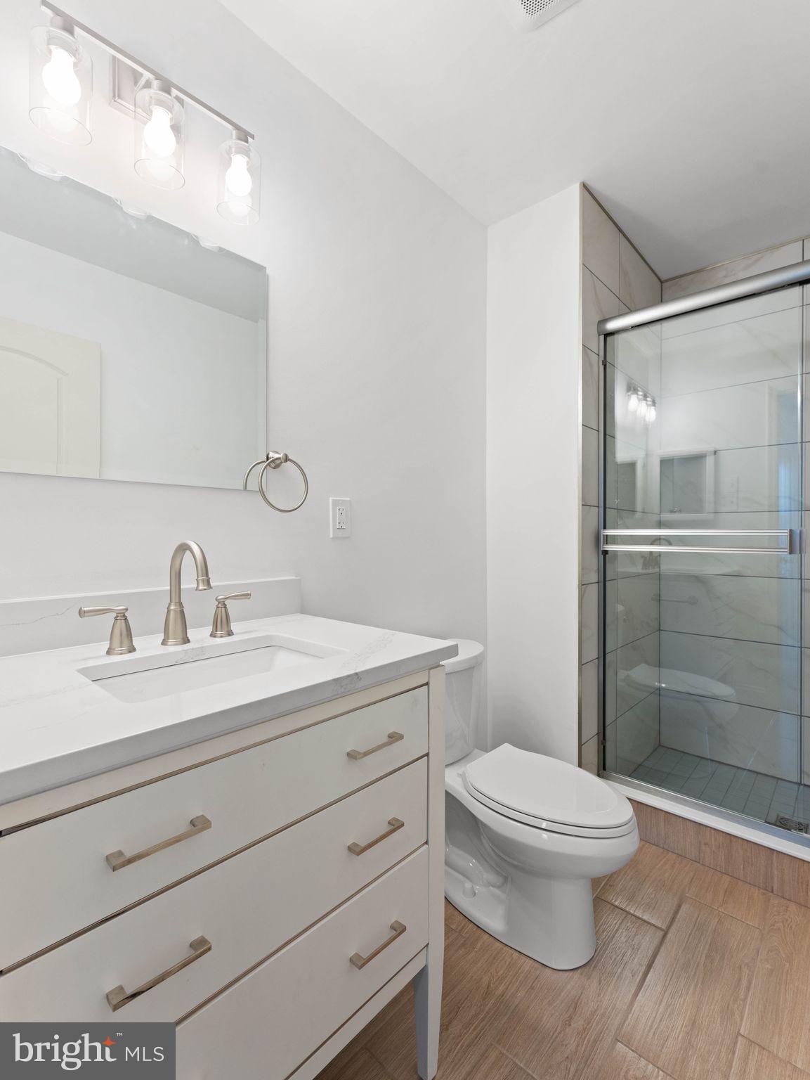 617 Caribbean Way Williamstown, NJ 08094 - Photo 16 of 26 a bathroom with a sink a toilet and shower