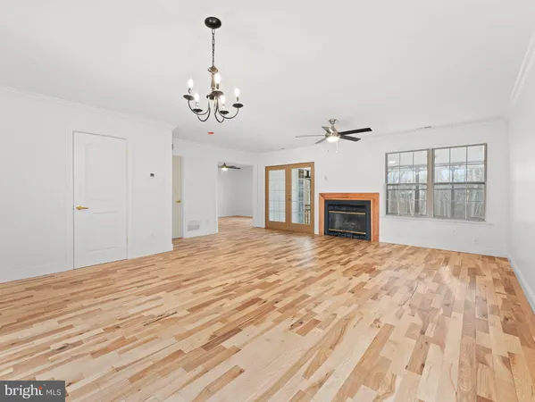 a bedroom with a large bed and flat tv