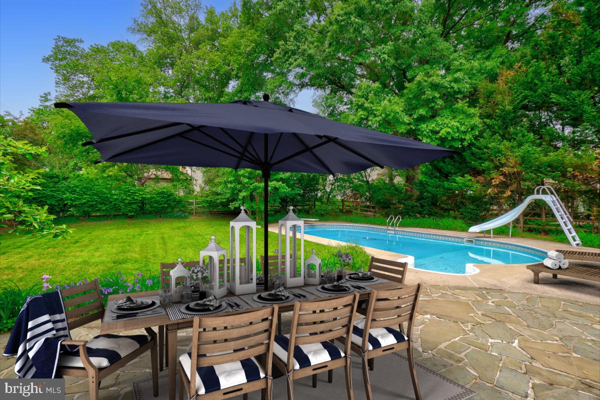 1816 Bart Drive Silver Spring, MD 20905 - Photo 24 of 38 an outdoor space with furniture and umbrella