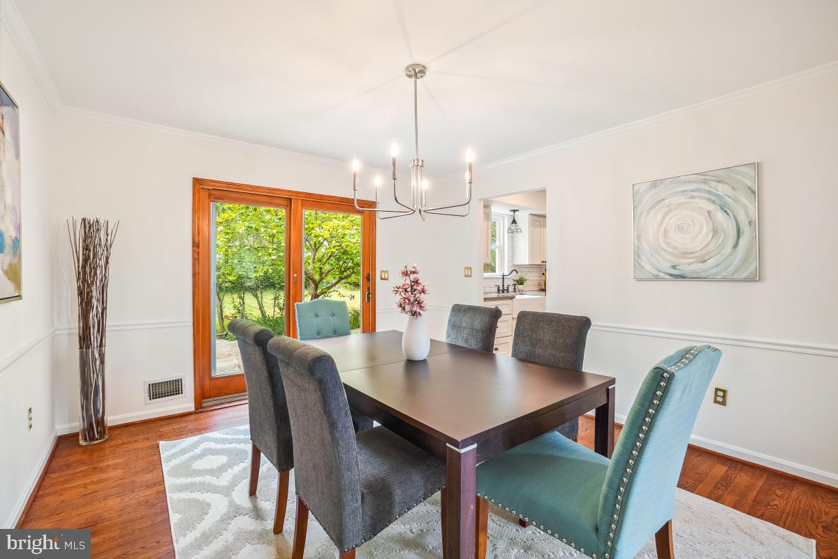 1816 Bart Drive Silver Spring, MD 20905 - Photo 6 of 38 a view of a dining room with furniture window and wooden floor