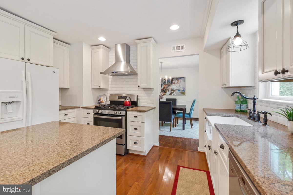 1816 Bart Drive Silver Spring, MD 20905 - Photo 10 of 38 a kitchen with stainless steel appliances granite countertop a sink stove and refrigerator