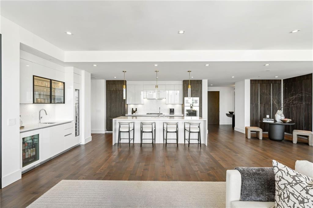3107 Peachtree Road Northeast, Unit 1402 Atlanta, GA 30305 - Photo 18 of 72 a living room with furniture and a table
