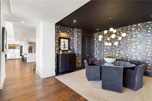 a view of a living room and a room with furniture