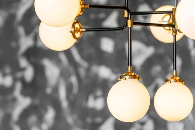 a bedroom with a bed couch and a large window