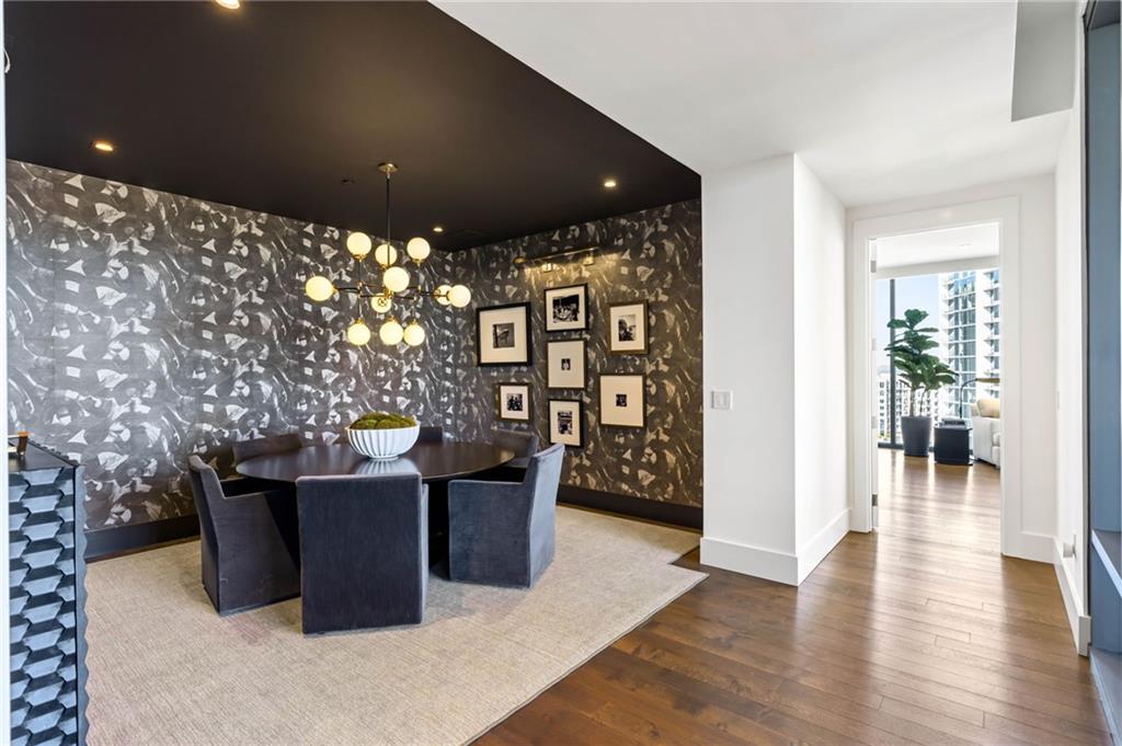 3107 Peachtree Road Northeast, Unit 1402 Atlanta, GA 30305 - Photo 28 of 72 a view of a living room and a room with furniture