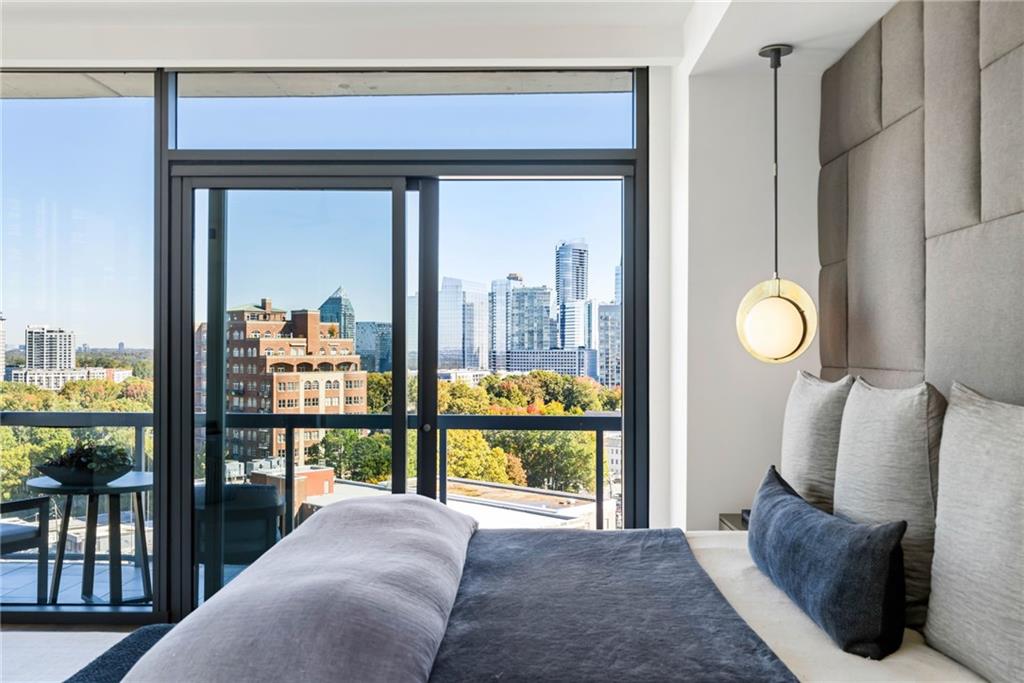 3107 Peachtree Road Northeast, Unit 1402 Atlanta, GA 30305 - Photo 30 of 72 a bedroom with furniture and a window