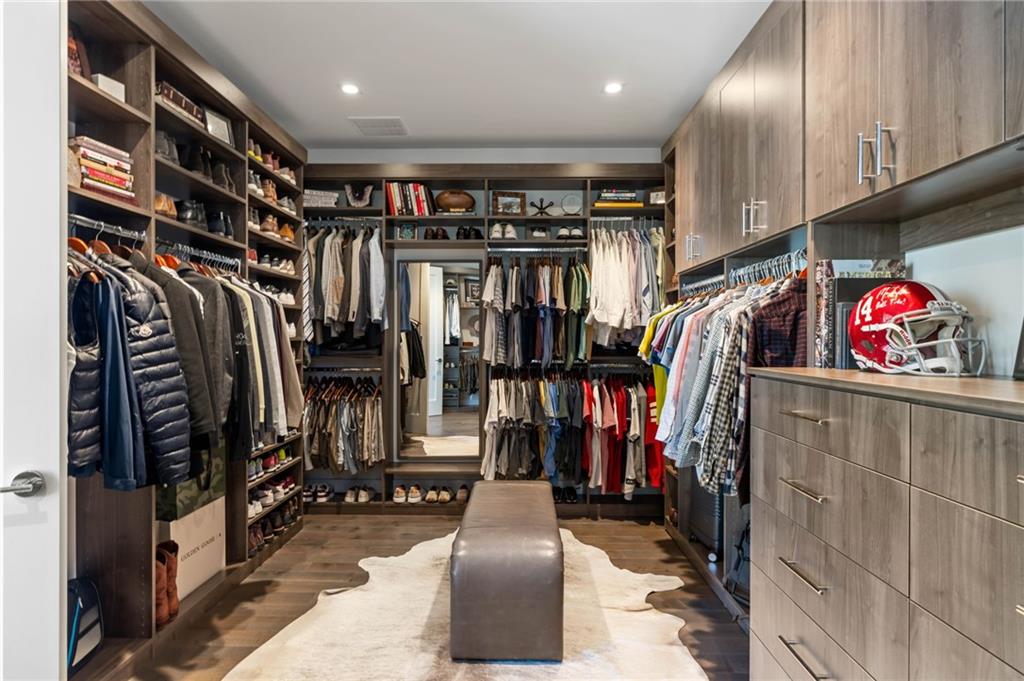3107 Peachtree Road Northeast, Unit 1402 Atlanta, GA 30305 - Photo 36 of 72 a view of walk in closet with clothes and shoes
