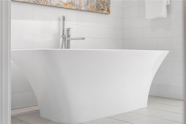 a living room with furniture a window and a table