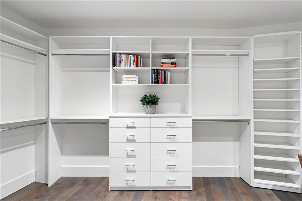 3107 Peachtree Road Northeast, Unit 1402 Atlanta, GA 30305 - Photo 43 of 72 a view of walk in closet with clothes and shoes