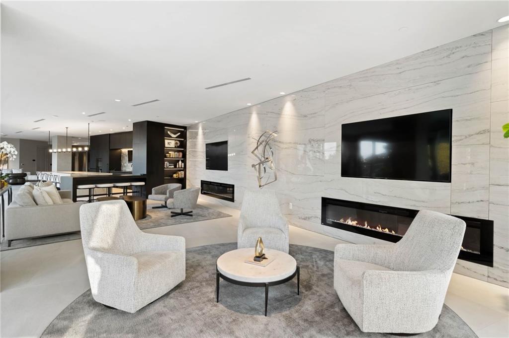 3107 Peachtree Road Northeast, Unit 1402 Atlanta, GA 30305 - Photo 53 of 72 a living room with furniture and a flat screen tv