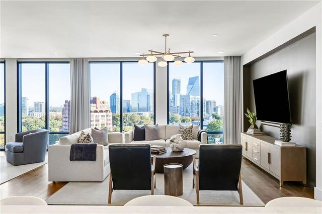 a living room with furniture and a flat screen tv