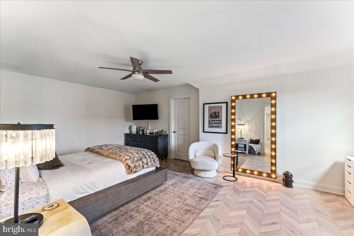 1202 Summit Drive Royersford, PA 19468 - Photo 29 of 35 a bedroom with a bed and a chandelier