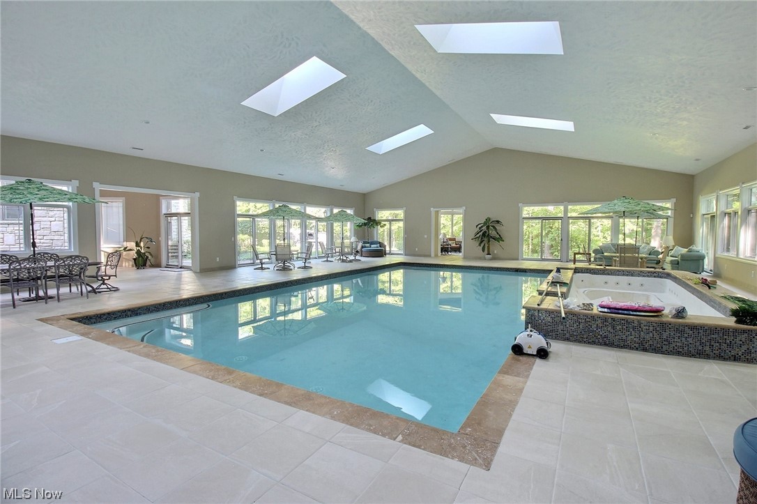 8525 Mentor Road Mentor, OH 44060 - Photo 7 of 13 View of swimming pool with a patio area and a skylights