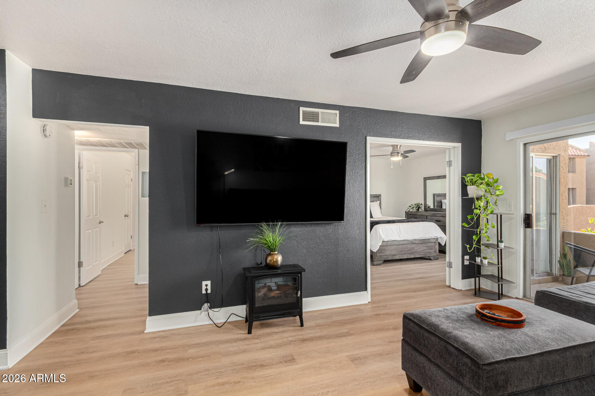 5877 North Granite Reef Road, Unit 1133 Scottsdale, AZ 85250 - Photo 21 of 33 a living room with furniture and a flat screen tv