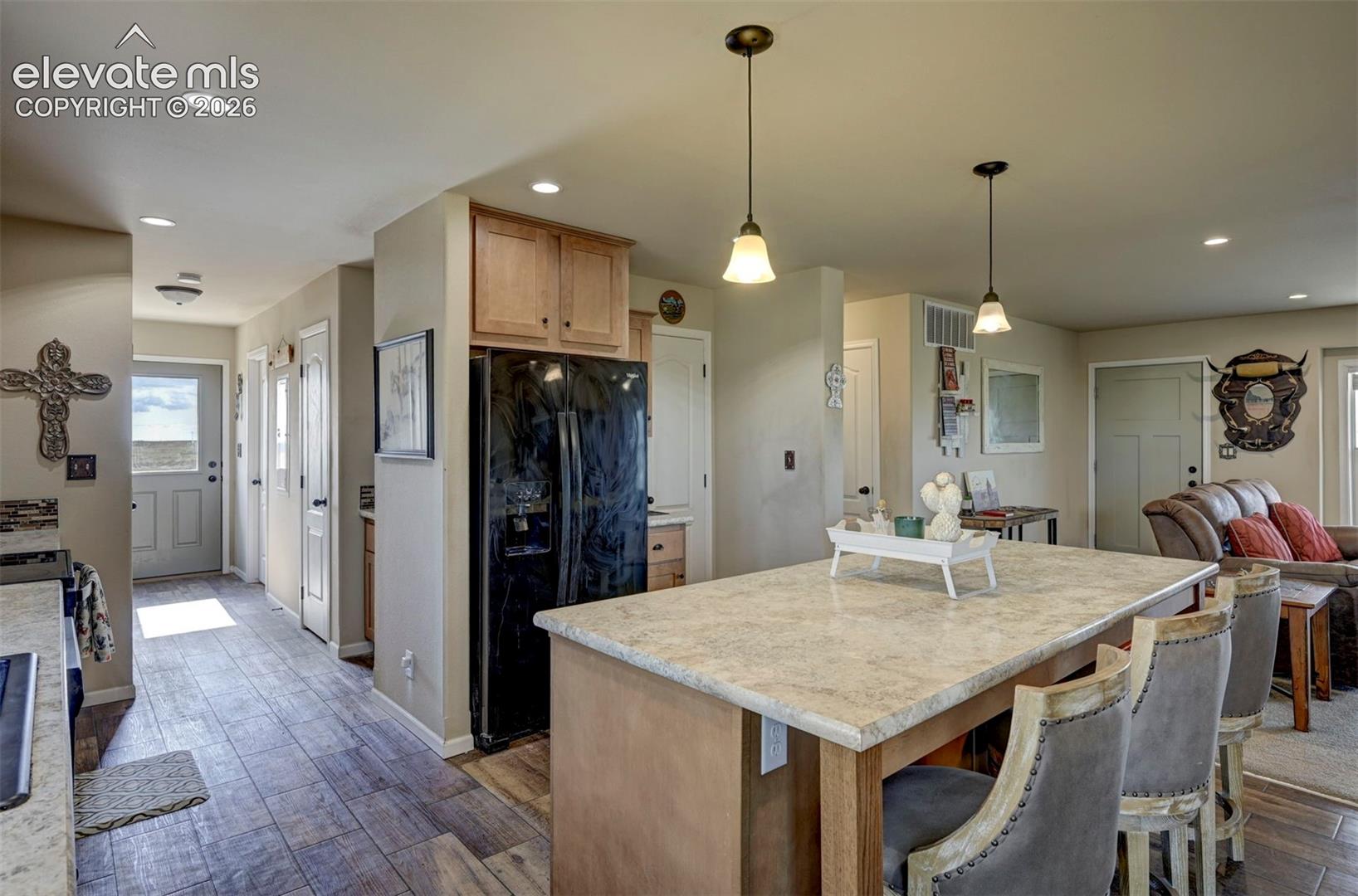 37485 Judge Orr Road Calhan, CO 80808 - Photo 19 of 50 island and hallway