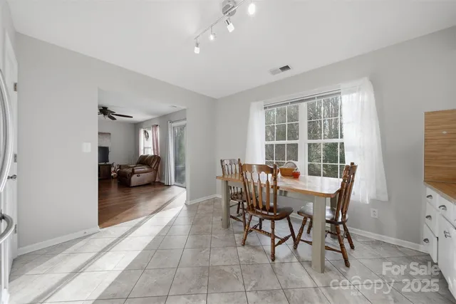 a view of a dining room with furniture and a livingroom