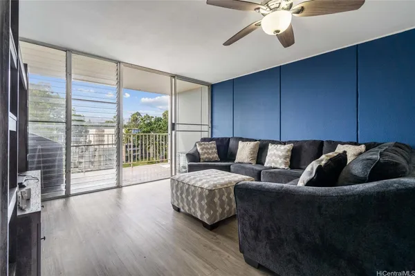 a living room with furniture and a large window