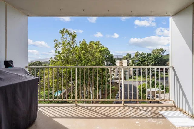 a view of a balcony and floor to ceiling windows