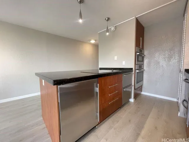 an empty room with wooden floor