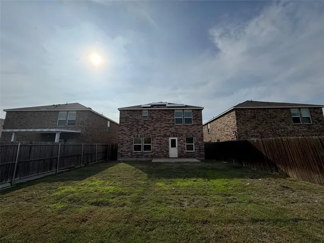 a view of house with yard