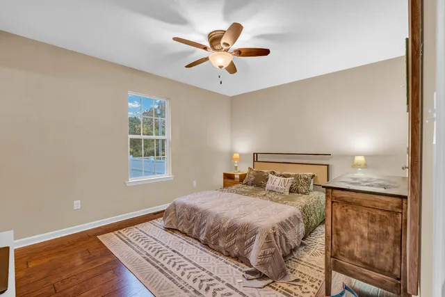 a bedroom with a large bed and a window