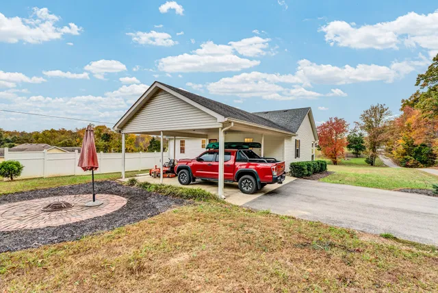 a view of a house with a porch and furniture