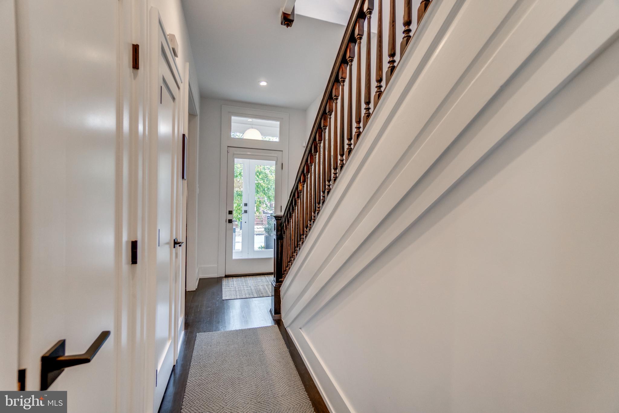 1009 Irving Street Northwest Washington, DC 20010 - Photo 18 of 33 Inviting entryway with elegant staircase.