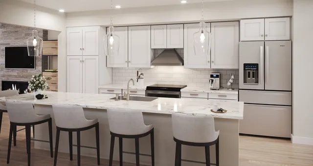 a kitchen with kitchen island granite countertop a sink cabinets and stainless steel appliances