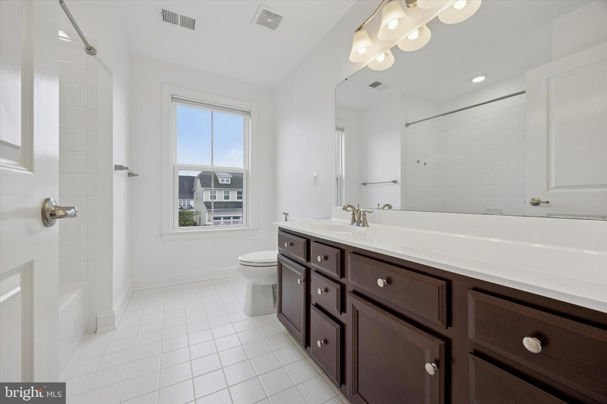 322 Quarry Point Road Malvern, PA 19355 - Photo 20 of 29 a spacious bathroom with a double vanity sink a mirror and a bathtub