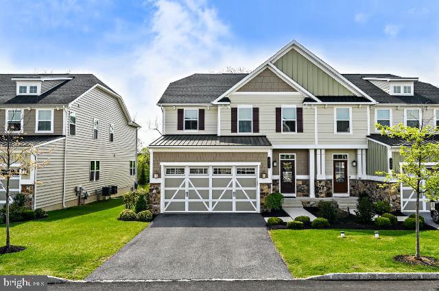 322 Quarry Point Road Malvern, PA 19355 - Photo 2 of 29 a front view of a house with a yard and garage