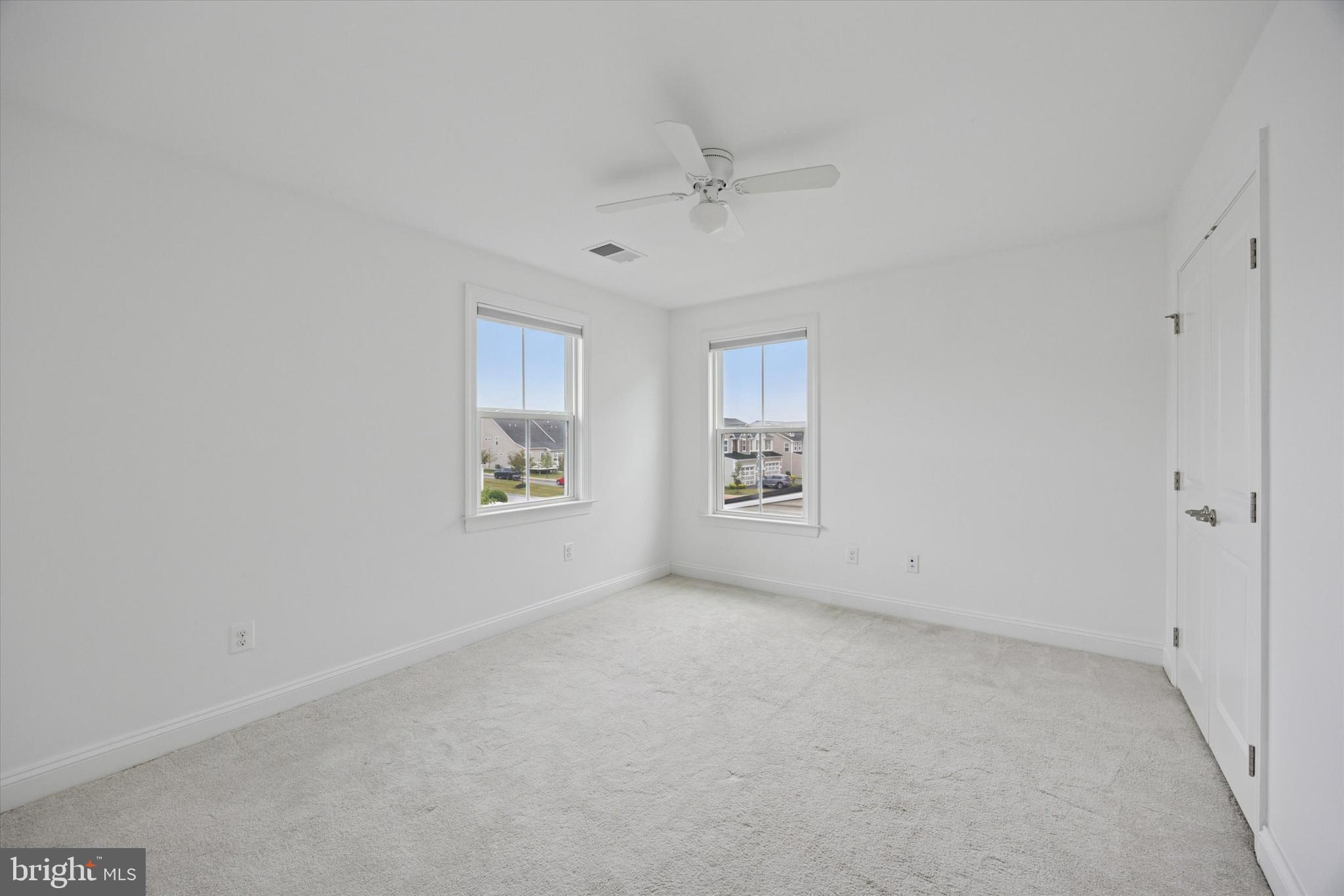 322 Quarry Point Road Malvern, PA 19355 - Photo 23 of 29 an empty room with windows and fan