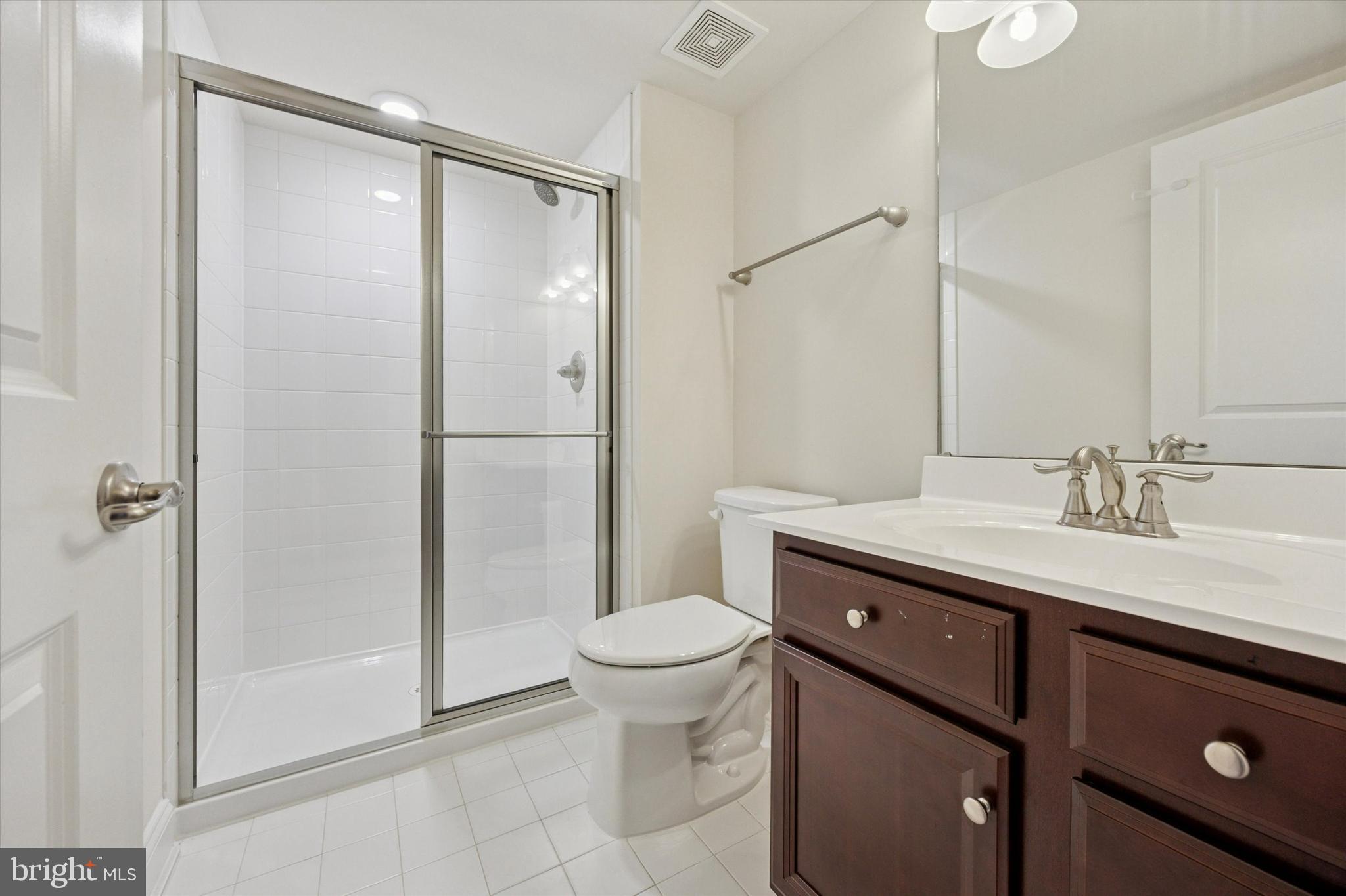 322 Quarry Point Road Malvern, PA 19355 - Photo 25 of 29 a bathroom with a granite countertop sink toilet and shower