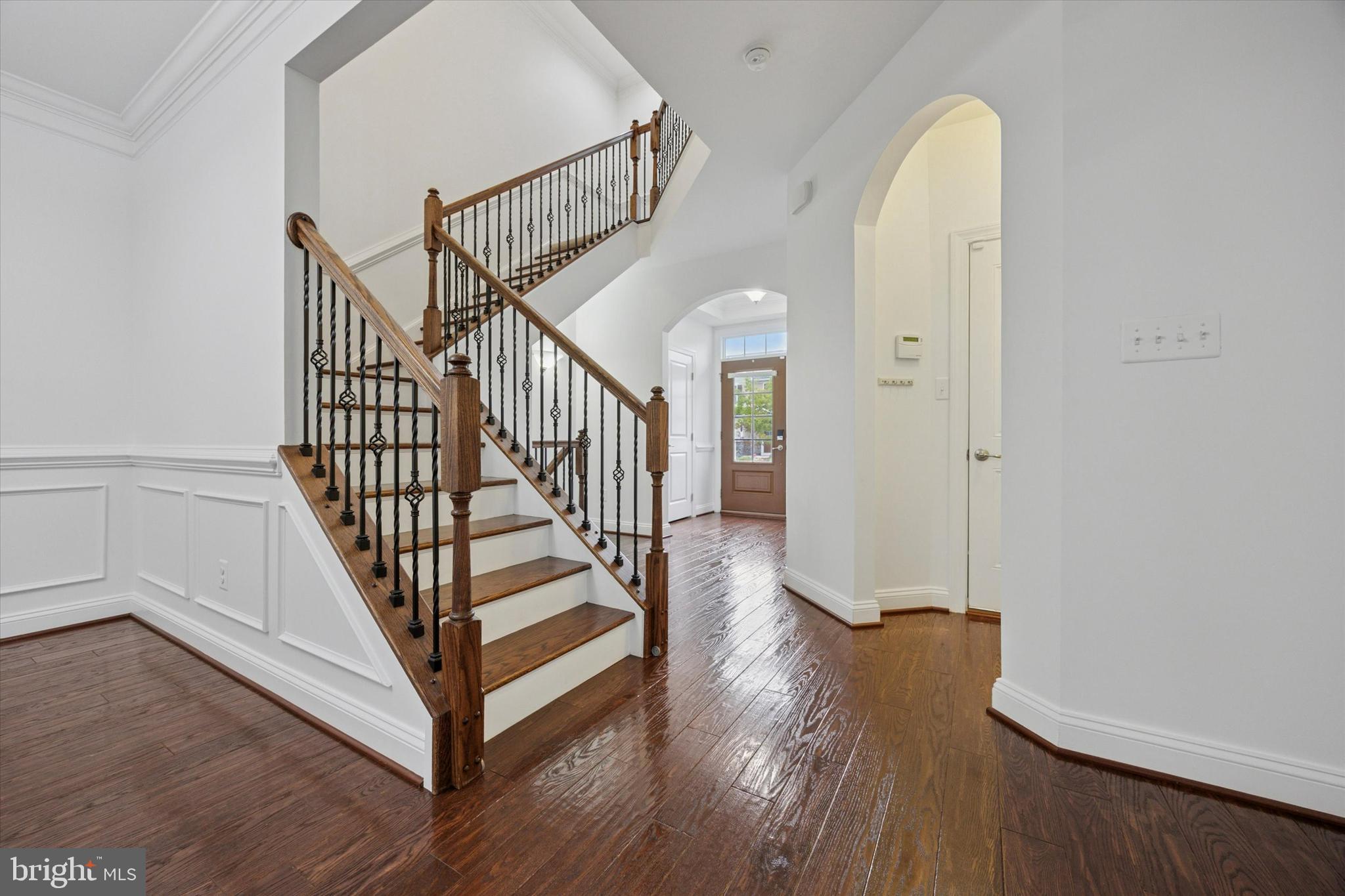 322 Quarry Point Road Malvern, PA 19355 - Photo 3 of 29 a view of a hallway with entryway wooden floor and front door