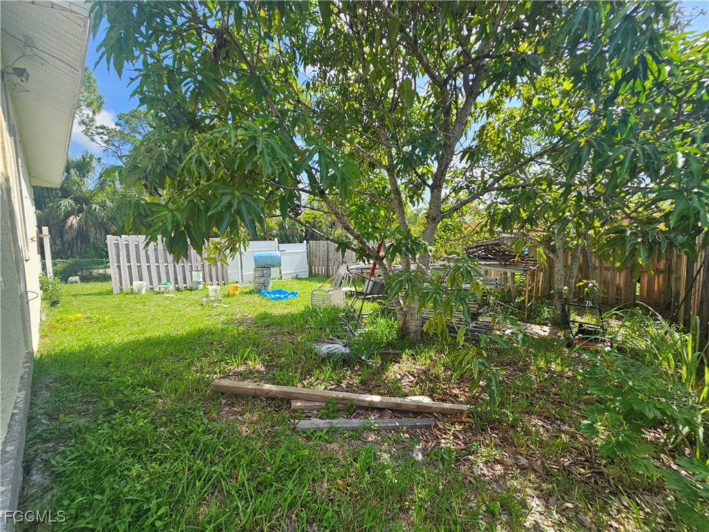 2912 Woodside Avenue Naples, FL 34112 - Photo 11 of 16 a view of a house with a yard