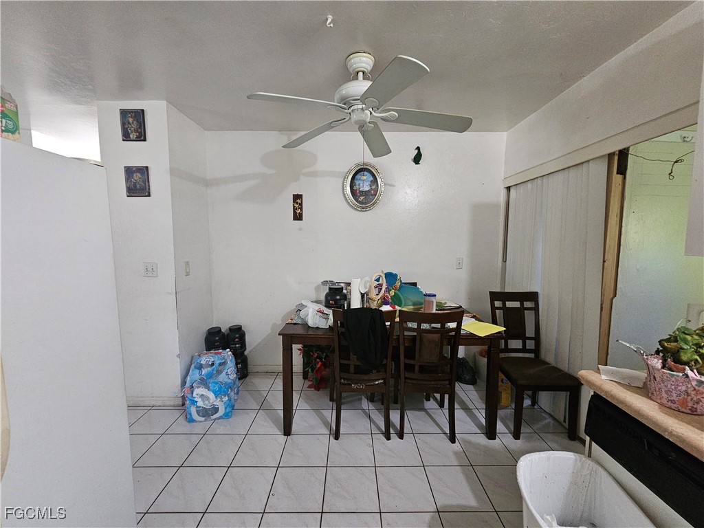2912 Woodside Avenue Naples, FL 34112 - Photo 5 of 16 a view of a dining room with furniture