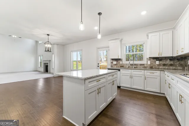 a bathroom with a sink toilet and mirror