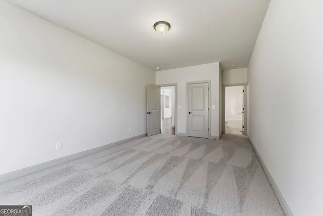 a view of a hallway with windows